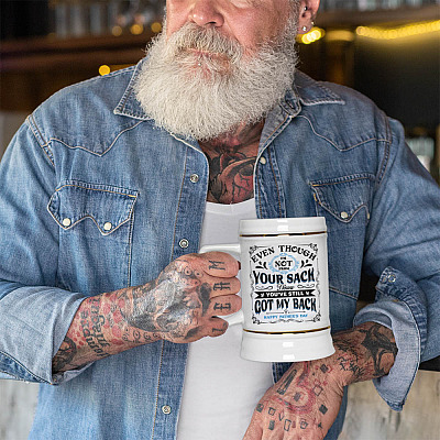 Even Though I'm Not From Your Sack Ceramic Coffee Mug - I Know You've Still Got My Back Happy Father's Day Mug-mockup-of-a-tattooed-man-holding-a-20-oz-beer-stein-by-a-bar