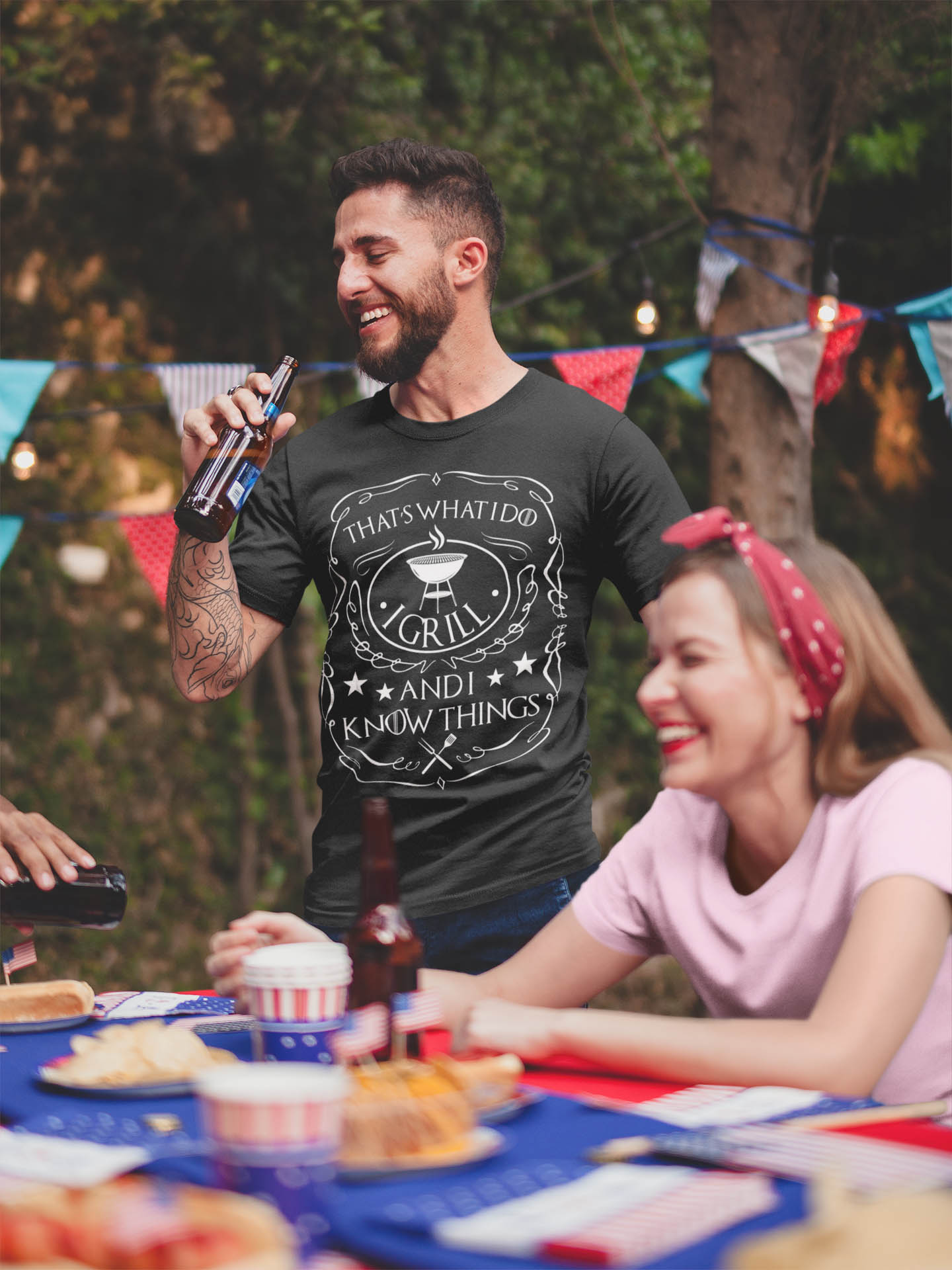That's What I Do I Grill I Drink I Know Things Barbecue T-Shirt - Funny BBQ Grilling Drinking Saying T-Shirt-tattooed-man-wearing-a-tshirt-mockup-drinking-a-beer-at-a-4th-of-july-bbq-party That's What I Do I Grill I Drink I Know Things Barbecue T-Shirt - Funny BBQ Grilling Drinking Saying T-Shirt-tattooed-man-wearing-a-tshirt-mockup-drinking-a-beer-at-a-4th-of-july-bbq-party