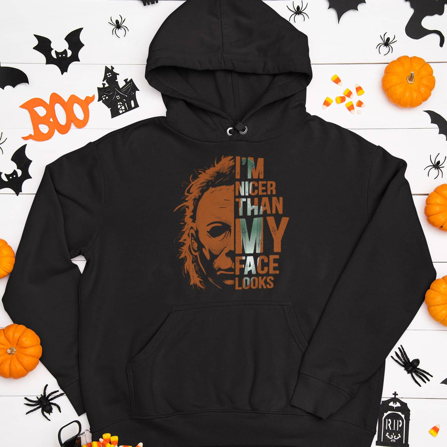 mockup-of-a-flat-laid-pullover-hoodie-surrounded-by-halloween-decor-items-m94 (1)(1)