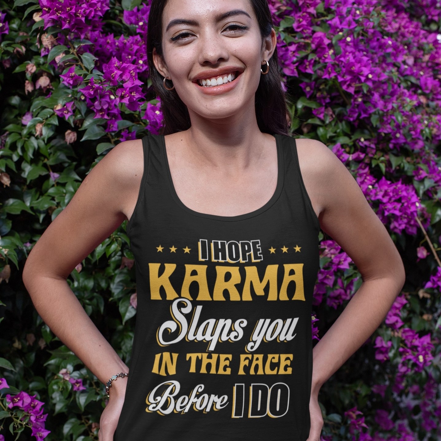 tank-top-mockup-featuring-a-joyful-woman-posing-by-a-flowering-plant-32059